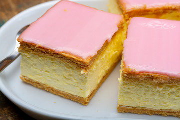 Tompoes or tompouce, iconic pastry in Netherlands and Belgium made from puff dough, icing, cream