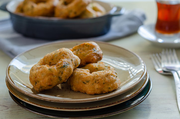 Traditional Turkish pastry : Pişi ; fried dough in oil with dill