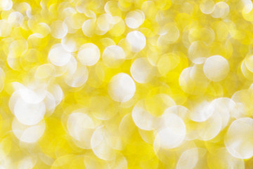 Shiny golden defocused glitter background.
