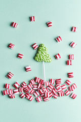 christmas candies on mint color background