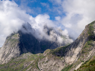 Clouds collide with the peaks of the mountain