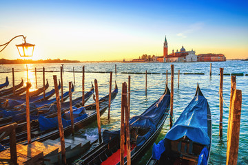 Gondolas moored at sunset, St. Mark's basin, Venice, Italy