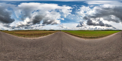 full seamless spherical hdri panorama 360 degrees angle view on old asphalt road among fields in autumn day with awesome clouds in equirectangular projection, ready for VR AR virtual reality content