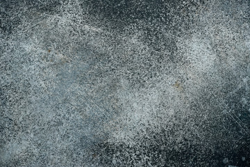 Dark wall texture with decorative plaster.