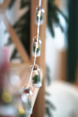 Beautiful Christmas garland in decorative jars on a bokeh background. Christmas theme design