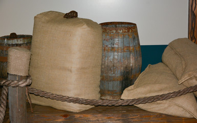 Sacks full and stacked on warehouse shelf