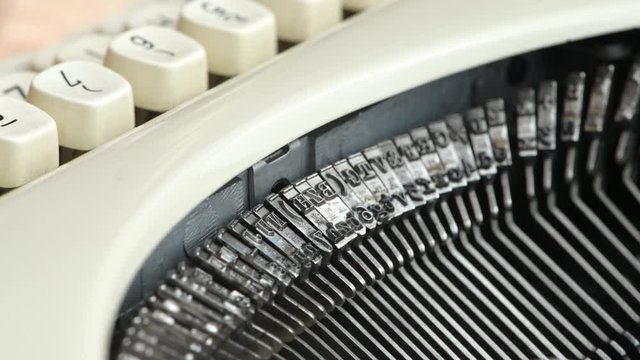 Closeup of the strikers on a vintage typewriter.