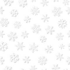 Christmas seamless pattern of snowflakes, gray on white background