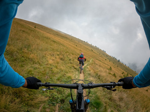 Two people mountain biking near Kals am Grossglockner, Lienz, Tyrol, Austria