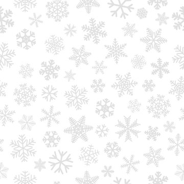 Christmas seamless pattern of snowflakes, gray on white background