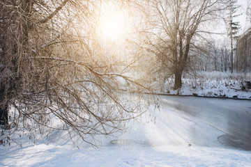 Winter landscape with the river and forest in frosty day