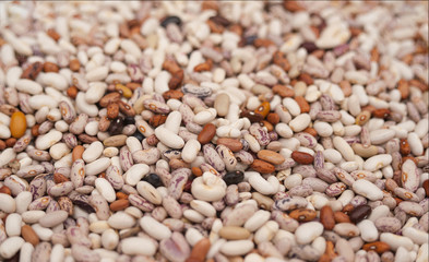 multicolored dried beans in a heap on the market