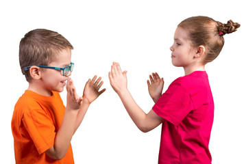 Brother and sister clap their hands. Isolated on a white background.