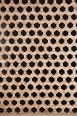 Abstract geometric background. Clay wall with polygon holes