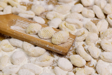 Fototapeta na wymiar Cook homemade gnocchi on the table, Italian tradition