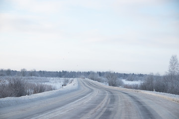 Fototapeta na wymiar Snowy winter road. Winter fairy tale. Ride on a winter road.