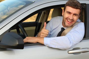 Elegant male driver giving a thumbs up 