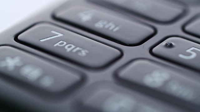 Close Up keyboard of the old Nokia 301 mobile phone. Tracking right shot