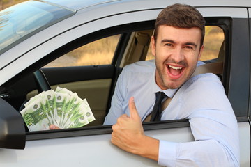 European driver holding 100 euro bills