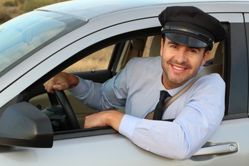 Fototapeta na wymiar Attentive looking professional driver smiling 