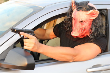 Spooky driver wearing a mask during Halloween