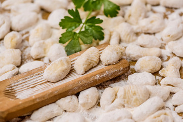 Cook homemade gnocchi on the table, Italian tradition
