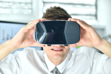Young Businessman Wearing Virtual Reality Googles.