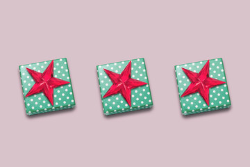 Christmas gift boxes and decorative star on pink background. christmas shopping