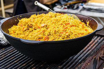 Big pan with pilaf on street festival