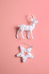 Christmas white star and reindeer toy on pastel  background.