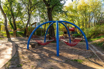 Hanging hammocks in a children playground at Bundek city park, Zagreb, Croatia