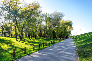 A scenic footpath along Bundek city park in a nice sunny day, Zagreb, Croatia