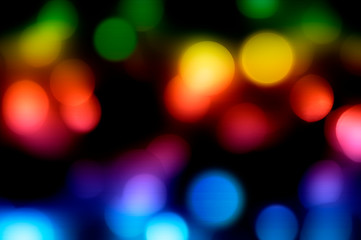 Defocused multicolor bokeh lights on a black background