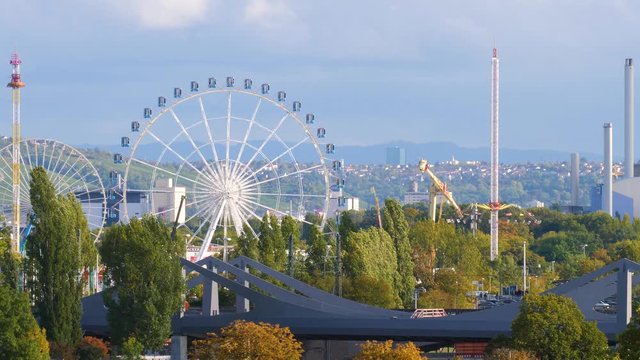 Stuttgart Cannstater Wasen Ferris wheel and other rides 4K panorama time lapse.