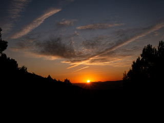 sunset in the mountains with high contrast