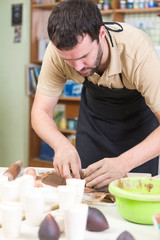 Selfless Professional Male Ceramist In Workshop. During a Process of Clay Preparation Using Special Tools.