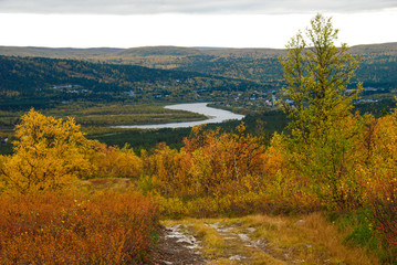 Naklejka na ściany i meble View of Tana river and Karasjok with autumn nature, Norway 