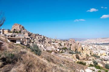 Panoramic photo of Uchisar carved old ancient houses with Pigeon Valley