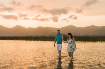 Fototapeta premium Pre wedding couple and amazing landscape in Torres beach.