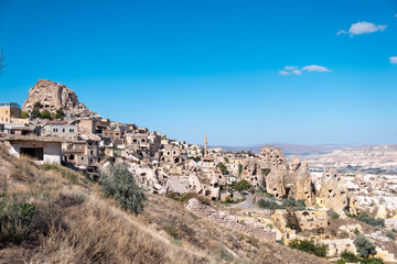 Fototapeta na wymiar Panoramic photo of Uchisar carved old ancient houses with Pigeon Valley