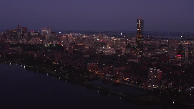 Aerial of Boston in evening, cityscape on sunset, the capital of Massachusetts, travel around US, a river through a city