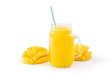Fresh tropical mango juice with beautiful diced pulp and striped paper straw isolated on white background table, close up, cut out, clipping path.