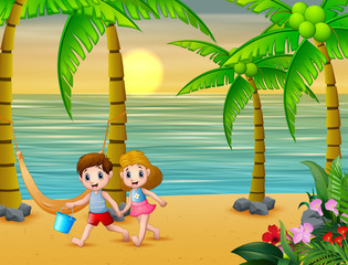 Obraz na płótnie Canvas Happy children playing on the beach