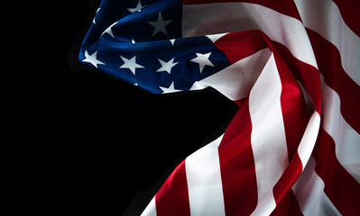 American flag on a black background with space for text