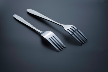 Fork and spoon on dark background, Restaurant concept. soft focus in the middle.