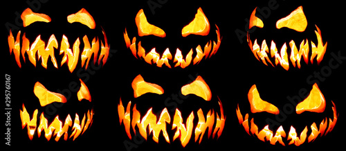 Collection of scary Halloween pumpkin Jack o lantern faces glowing red and yellow eerily on black