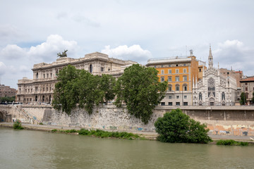 Panoramic view of city Rome with river Tiber and old church on other coast