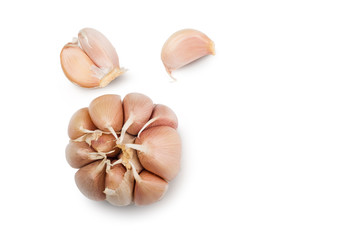 Fototapeta na wymiar Beautiful white garlic cloves rests on a white background. Top view isolated with clipping path.