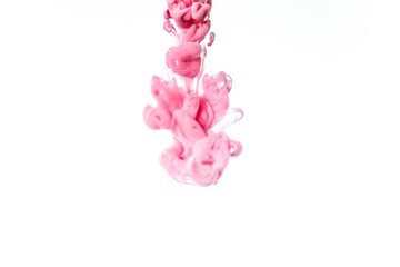 Colorful ink in water isolated on white background. Abstract pink paint splash.