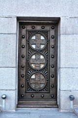 an old wooden door with metal reinforcements